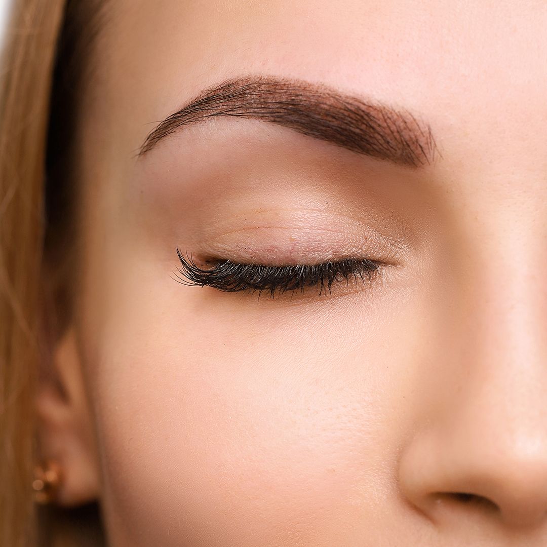 Close up view of beautiful woman with powder brows