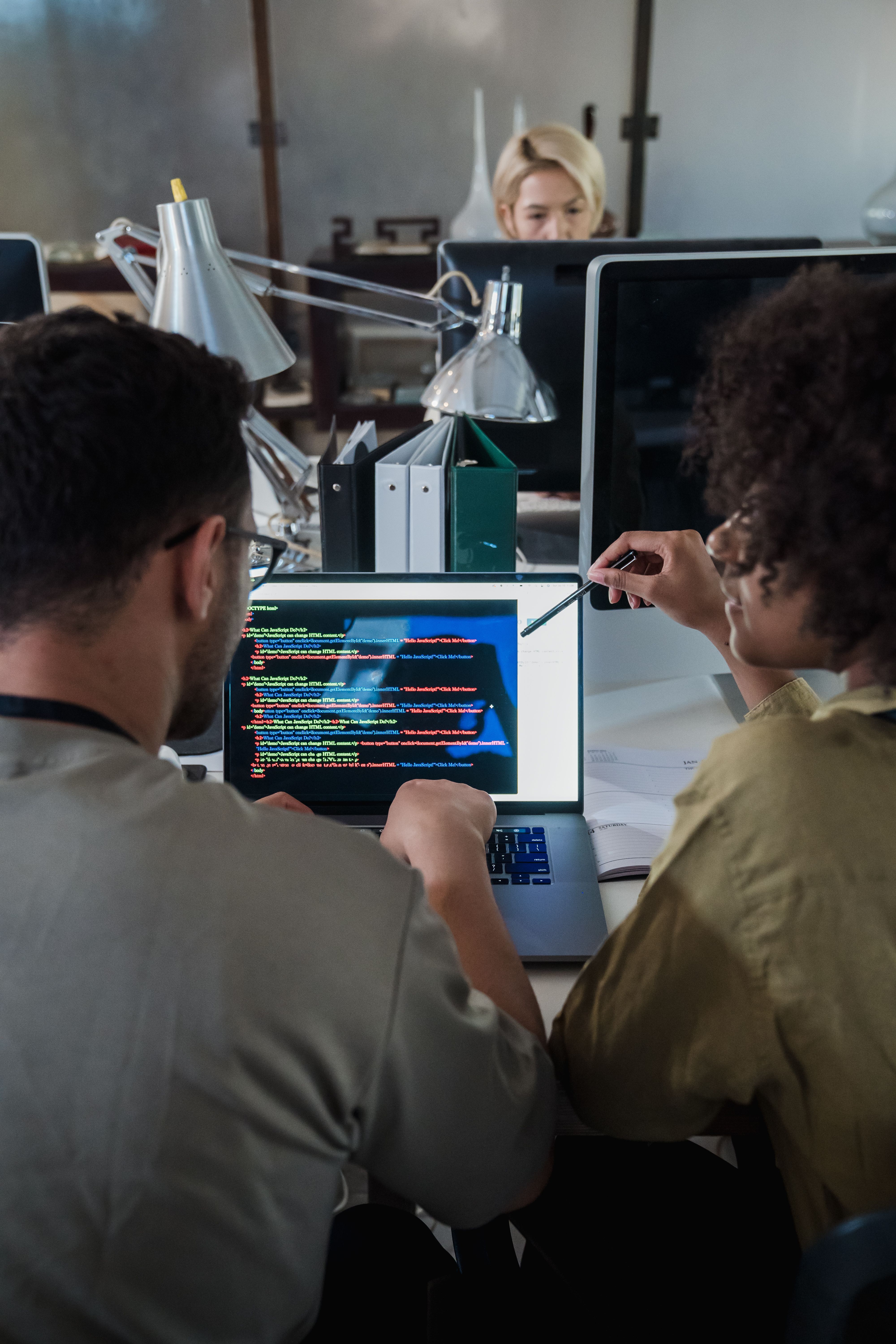 Remote developer coding team working on laptop office