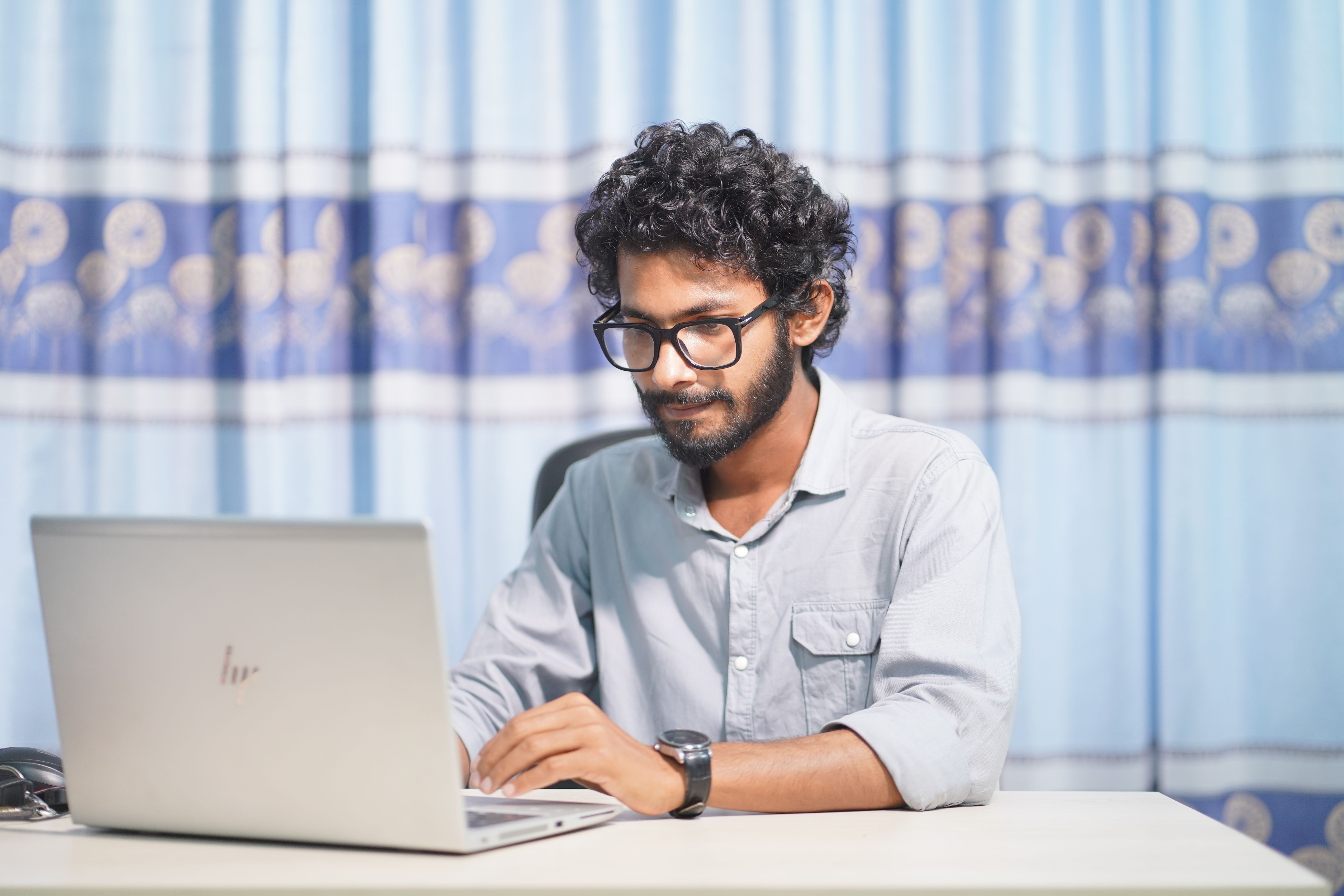 person working on laptop focused developer