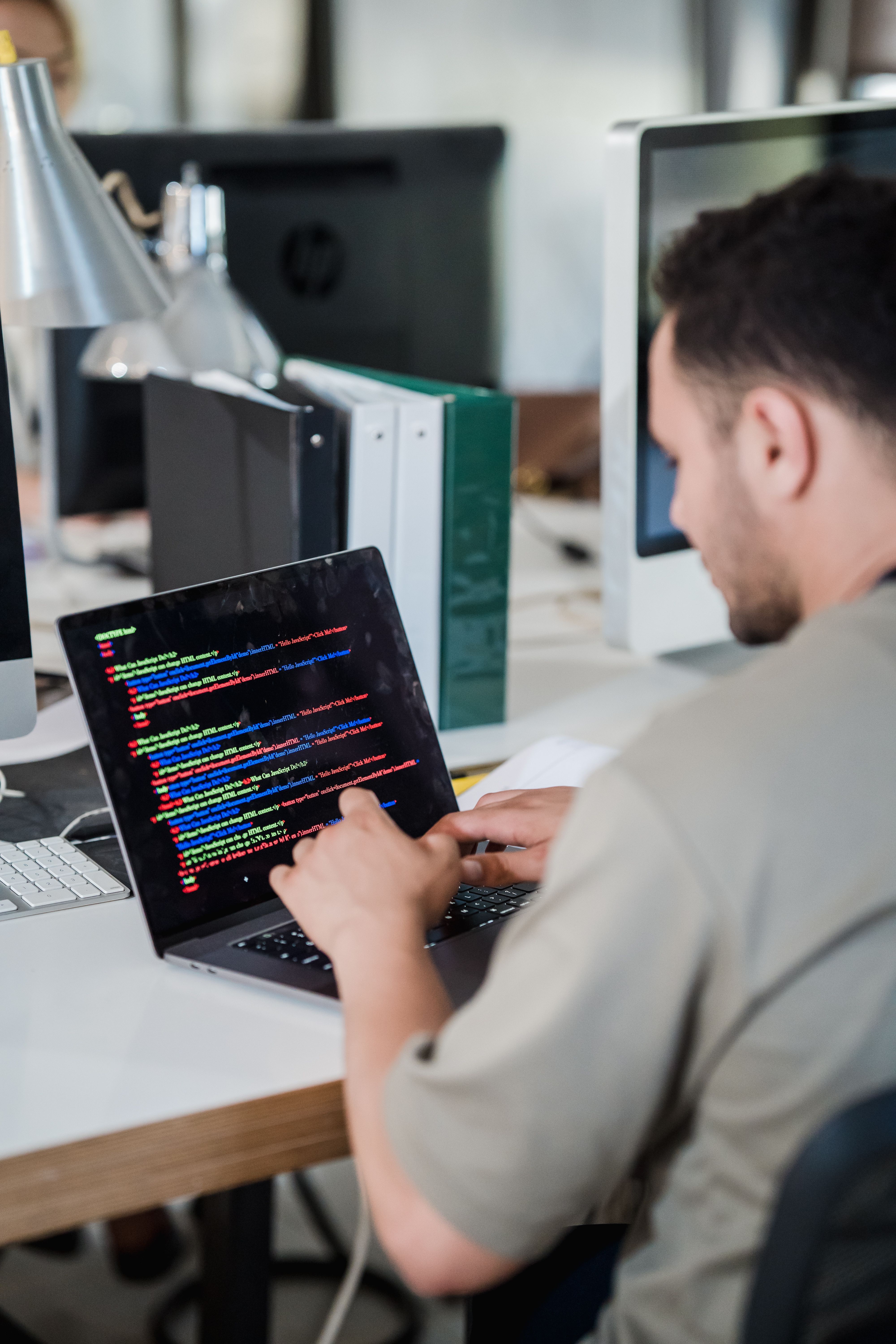 Software engineer coding laptop modern office