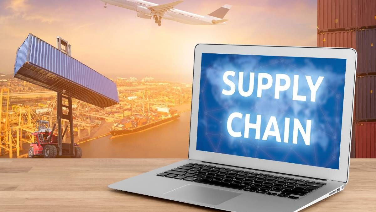 Laptop showing a supply chain network with an aircraft taking off over a container port behind it