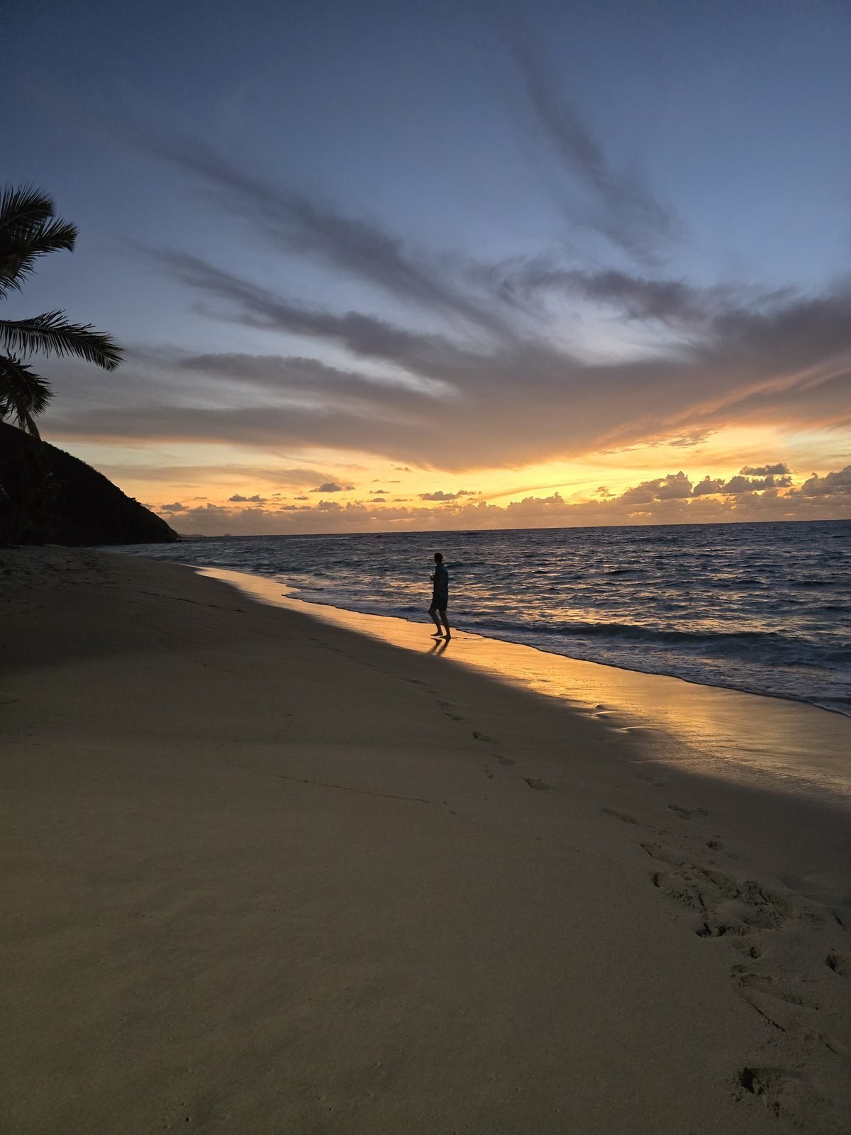 A last walk along the beach at sunset