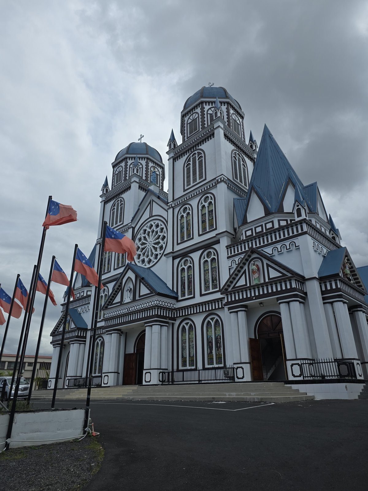 A painted church with Samoan flags flying