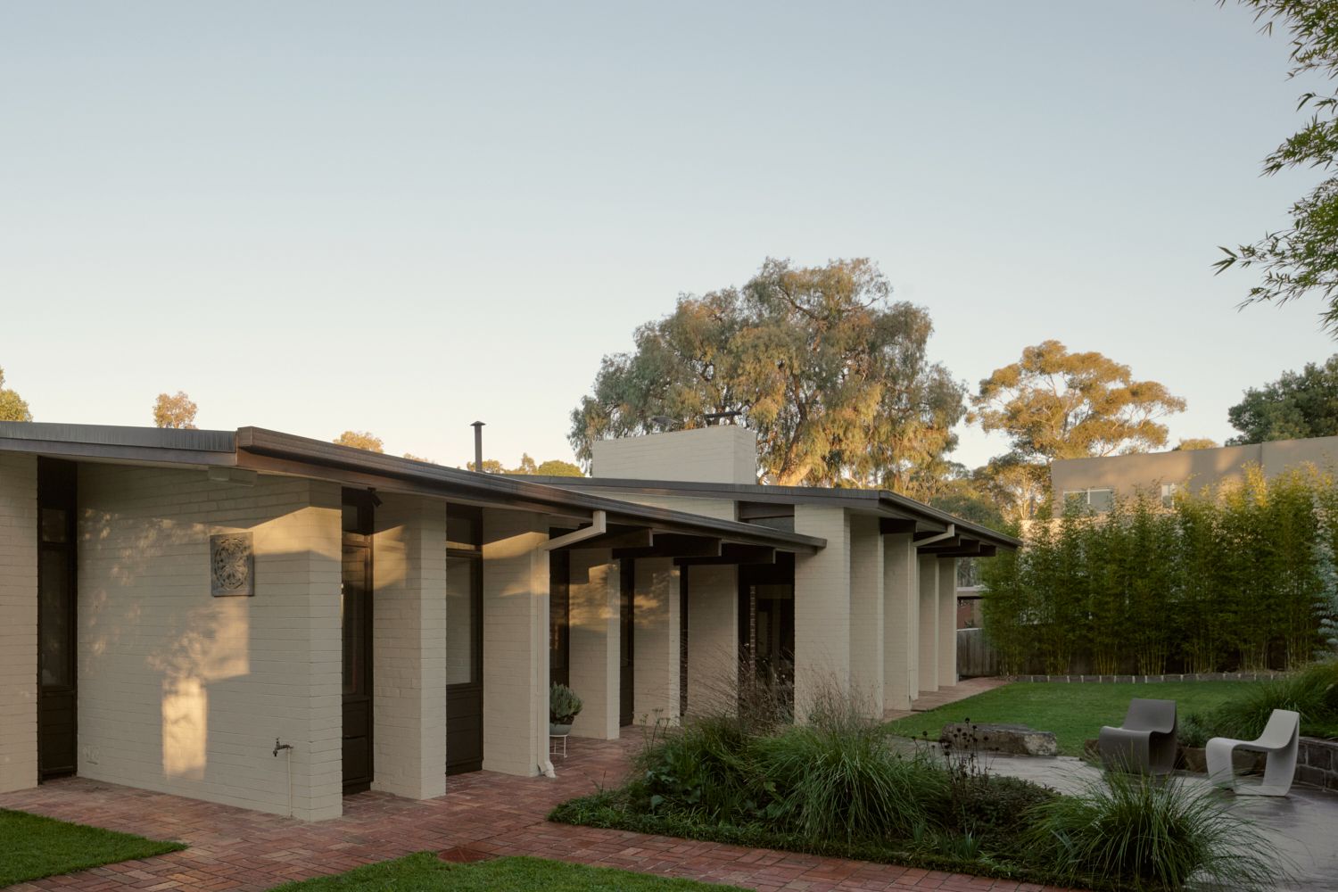 Wildwood from the eastern side showing the early morning winter light. | Wildwood by Robin Boyd | Vermont, Victoria | Noble family | Architectural Photography by Veeral Patel