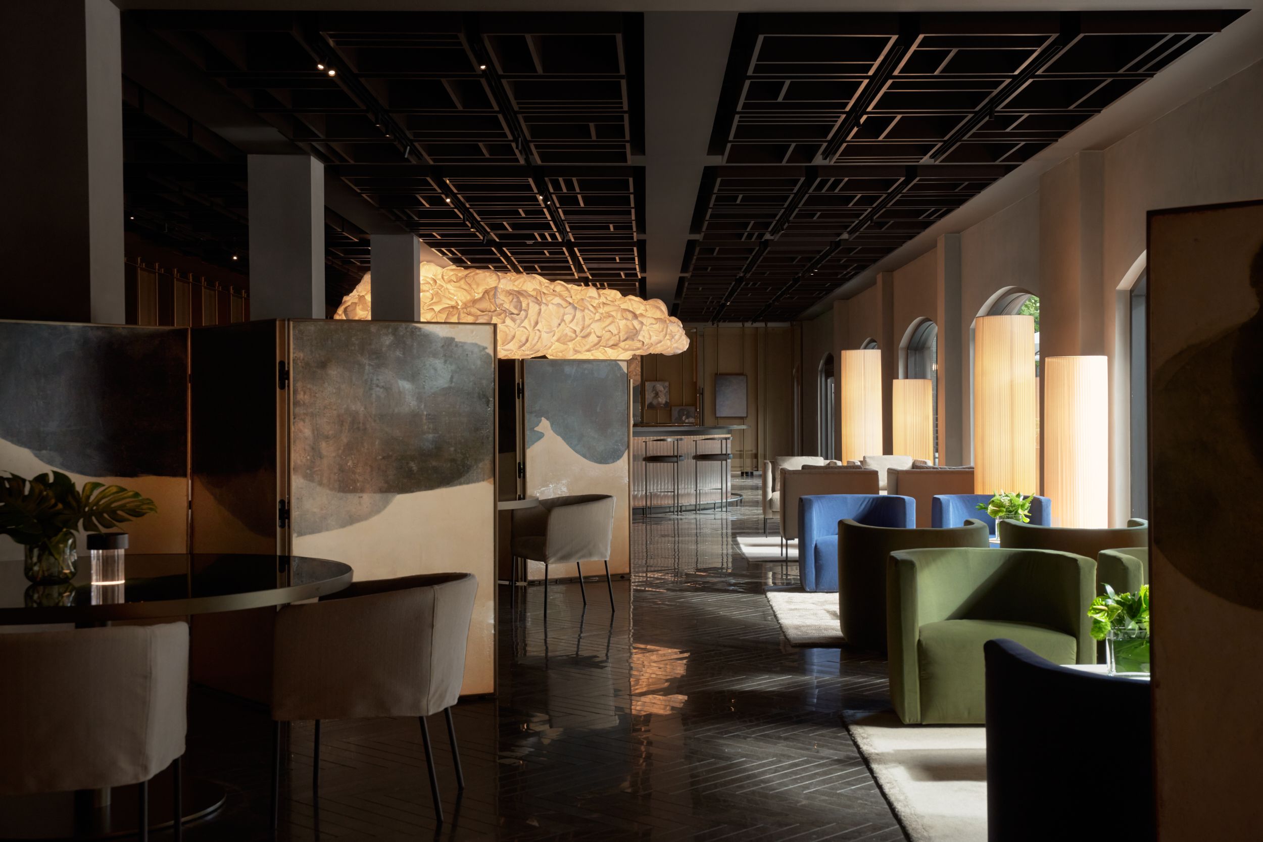 The seating area alongside the glass wall of the restaurant of AKA Alexandria.  | AKA Hotel Alexandria | Alexandria, Virginia, USA | Architecture and Interiors by Lissoni Partners | Photography by Veeral Patel