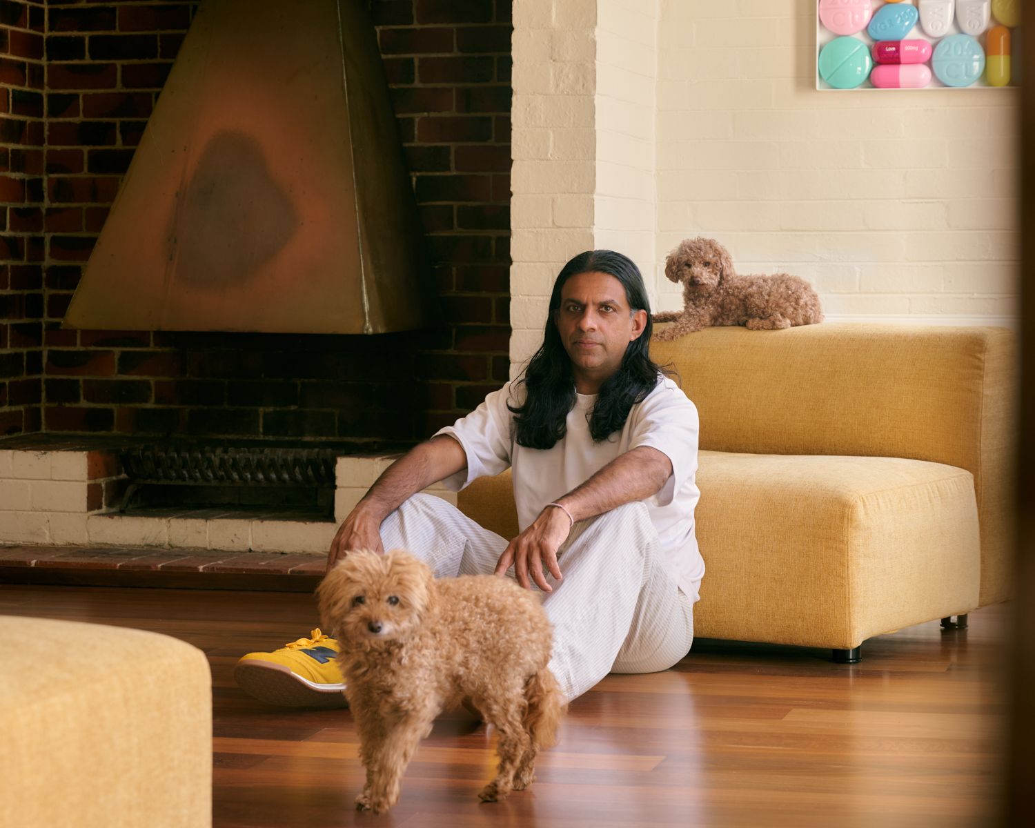 Portrait of Veeral Patel, Melbourne architectural filmmaker and photographer and founder of MR VEERAL, inside Wildwood, Vermont Victoria. Midcentury architecture designed by Robin Boyd. Self-portrait by Veeral Patel.