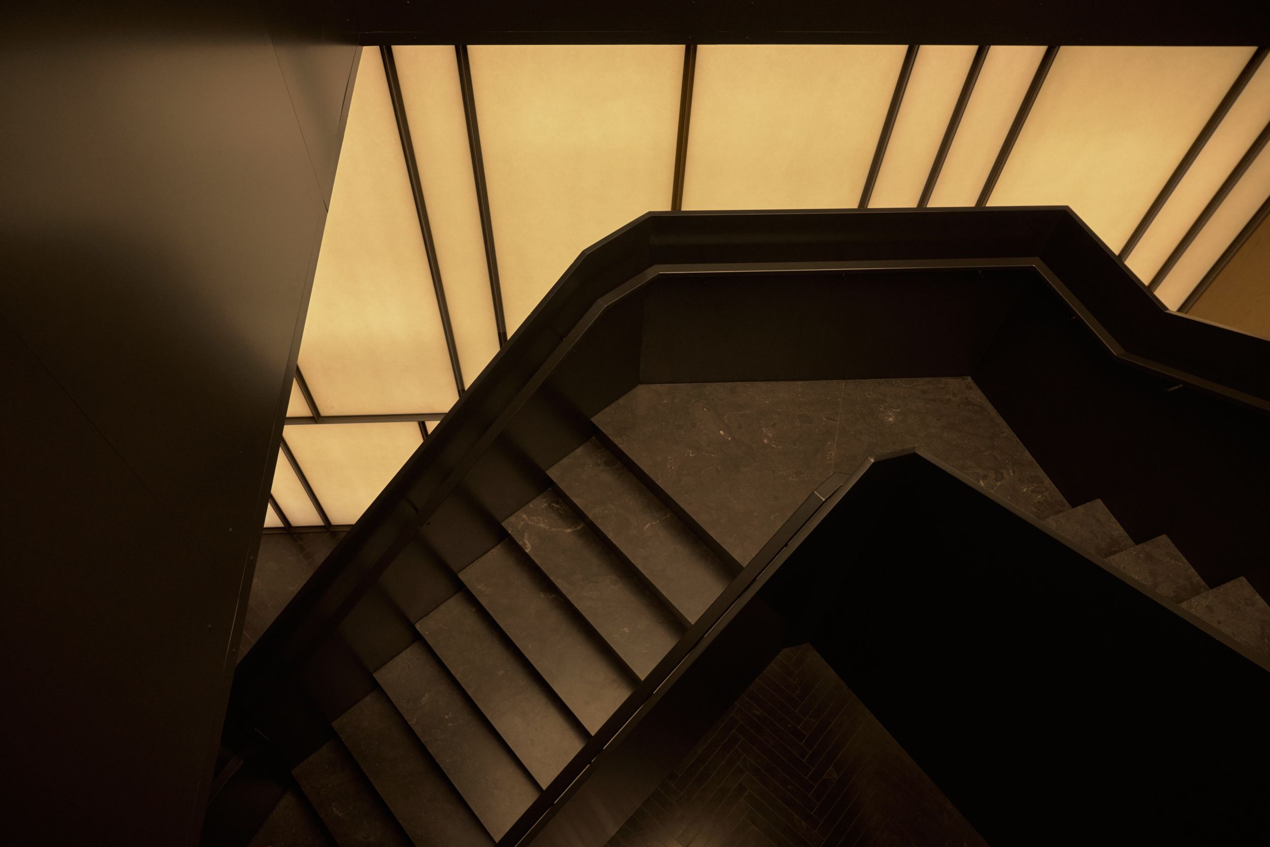 The folded metal staircase against the mid-century inspired Japanese screen. | AKA Hotel Alexandria | Alexandria, Virginia, USA | Architecture and Interiors by Lissoni Partners | Photography by Veeral Patel
