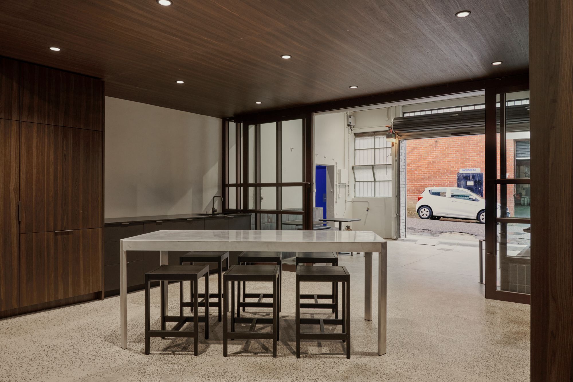 A view of the dinning table inside kitchen space at the ground level of the office.  | LSR Workplace by Made For | South Melbourne | Veeral Patel