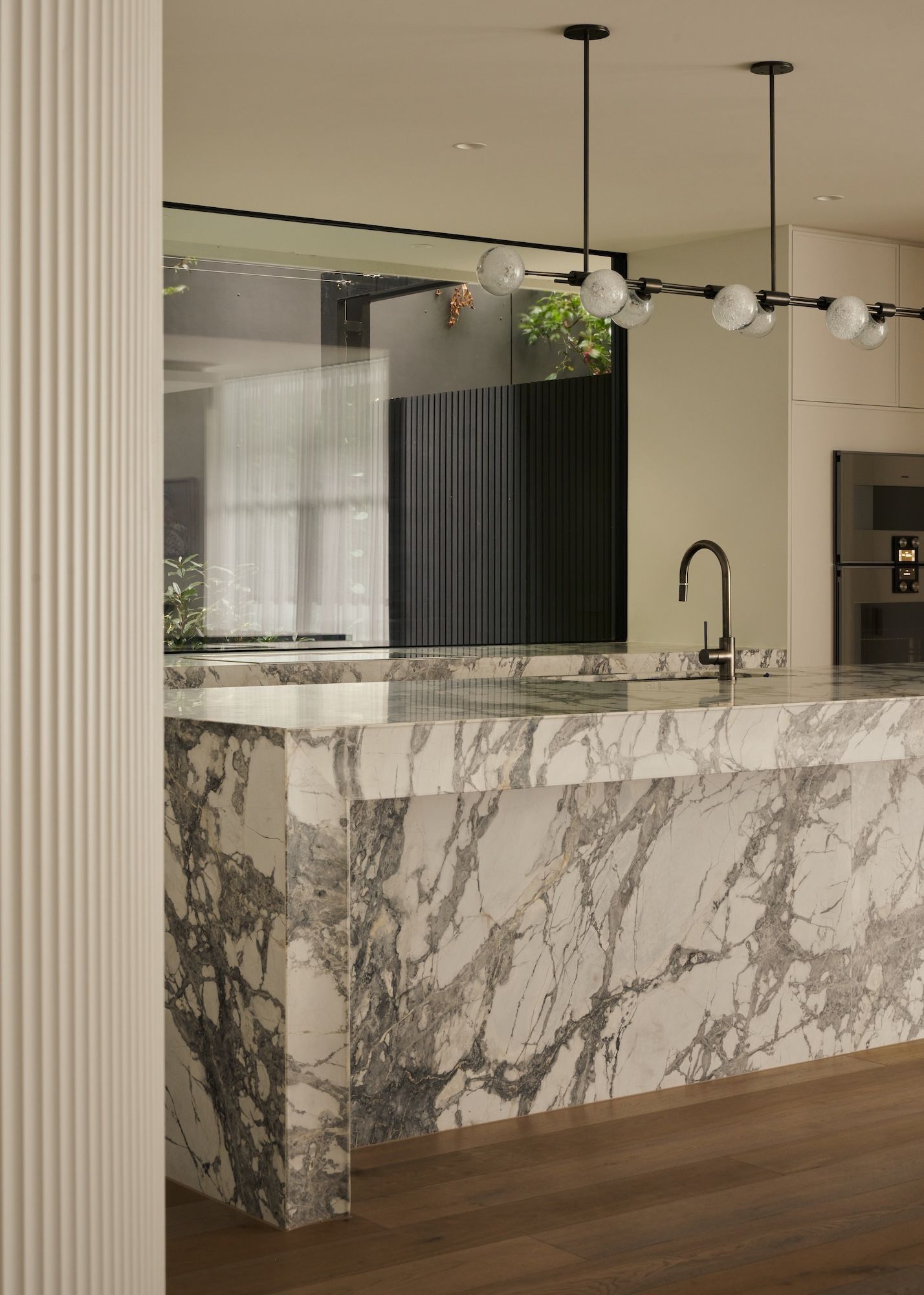 A detailed view of the corner of the kitchen covered in marble stone.   | Straun Residences interior architecture by Mim Design and built by Virgon Constructions | Mim Design | Toorak, Victoria | Architectural Photography Veeral Patel