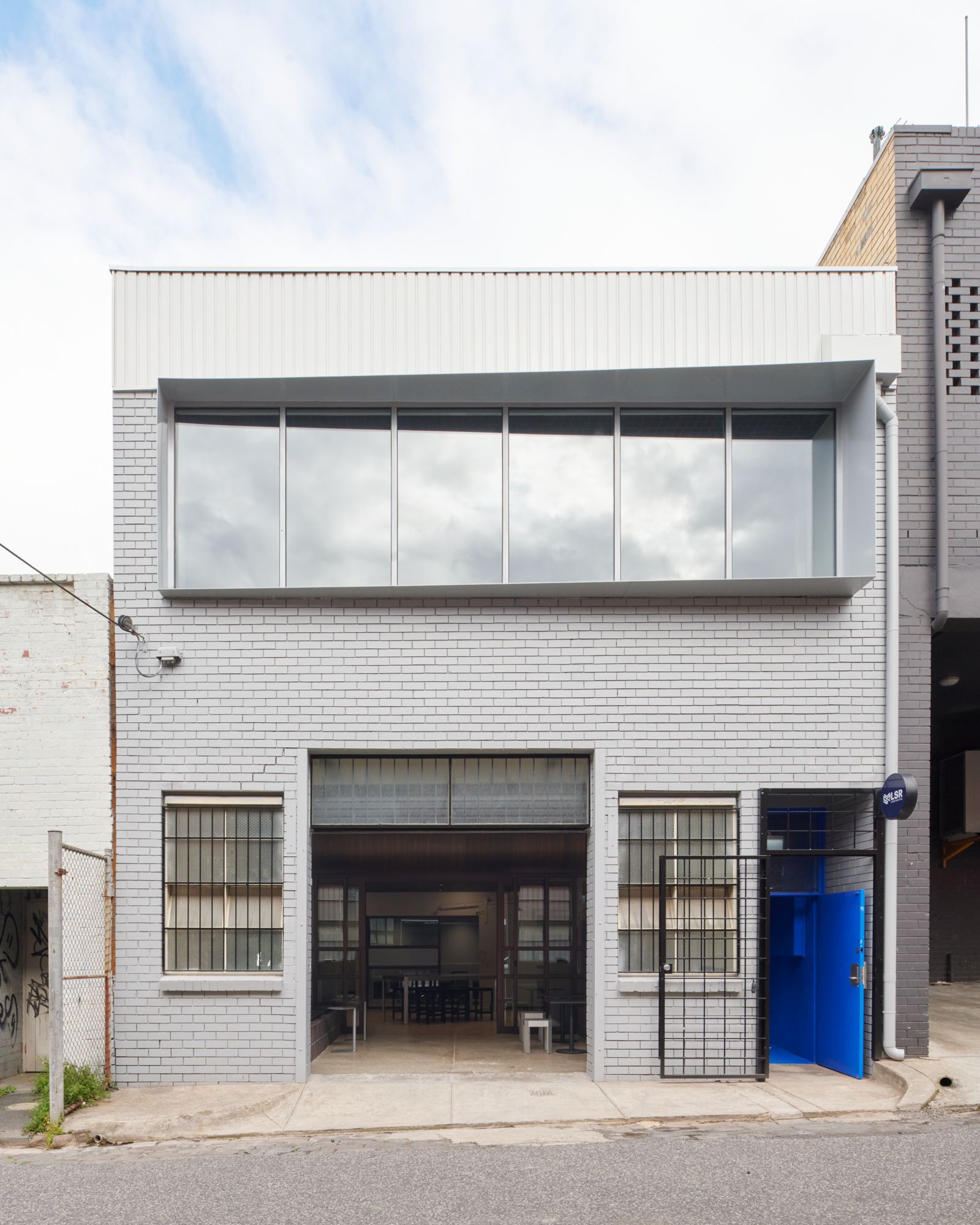 An exterior elevational image of LSQ Construction's HQ showing the brick facade. | LSR Workplace by Made For | South Melbourne | Veeral Patel