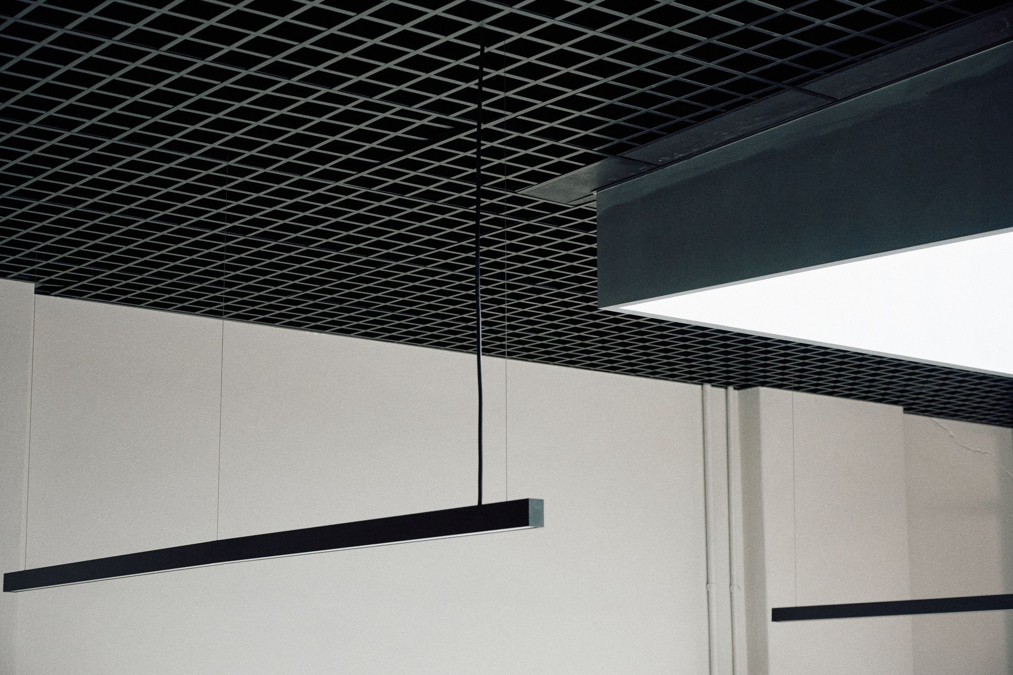 Detailed view of the ceiling grid with the skylight's shroud. | LSR Workplace by Made For | South Melbourne | Veeral Patel