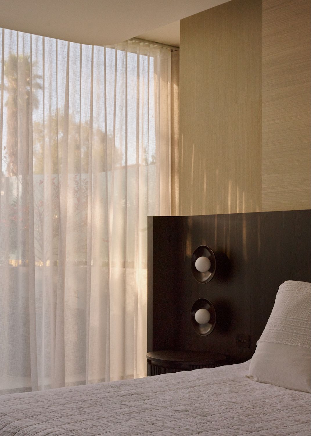 Winter light streaming through the bedroom,showing bespoke bedheap unit. | Straun Residences interior architecture by Mim Design and built by Virgon Constructions | Mim Design | Toorak, Victoria | Architectural Photography Veeral Patel