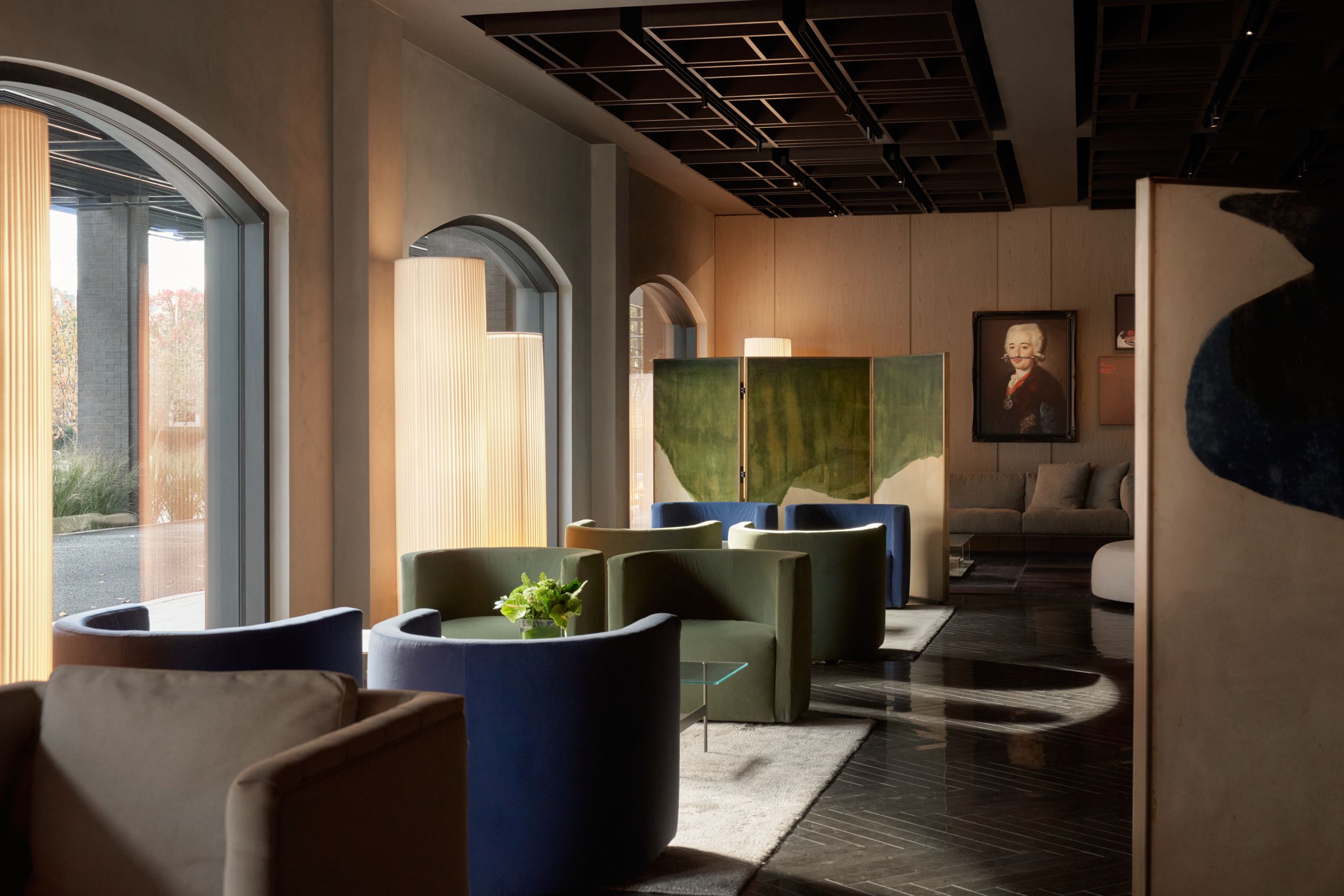 The seating area alongside the glass wall of the restaurant of AKA Alexandria.  | AKA Hotel Alexandria | Alexandria, Virginia, USA | Architecture and Interiors by Lissoni Partners | Photography by Veeral Patel