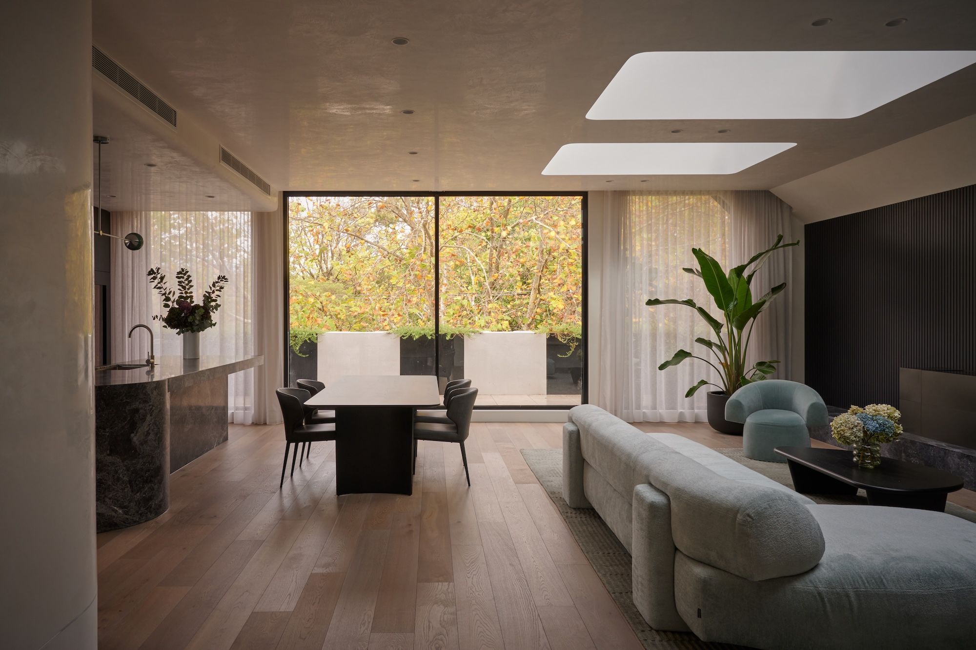 Apartment looking across to Straun street, winter leaves on the oak tree.  | Straun Residences interior architecture by Mim Design and built by Virgon Constructions | Mim Design | Toorak, Victoria | Architectural Photography Veeral Patel