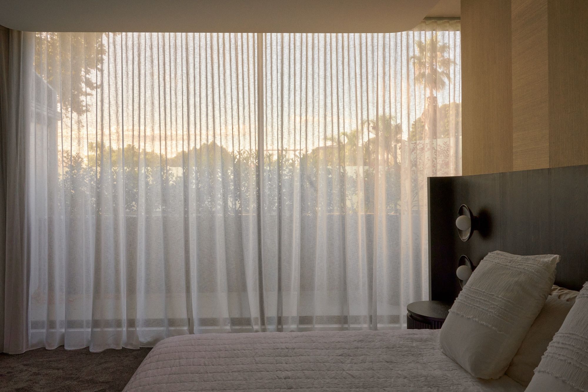 Winter light streaming through the bedroom,showing bespoke bedheap unit. | Straun Residences interior architecture by Mim Design and built by Virgon Constructions | Mim Design | Toorak, Victoria | Architectural Photography Veeral Patel