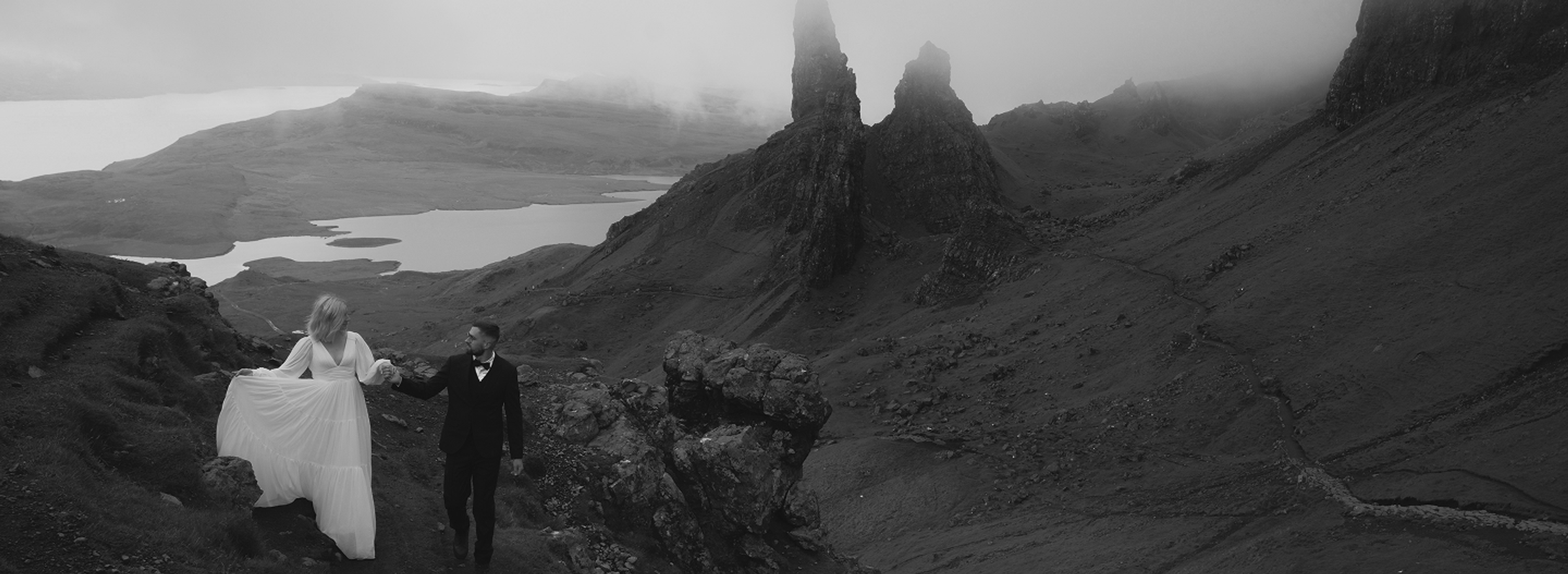 Couple embracing on a mountain ridge