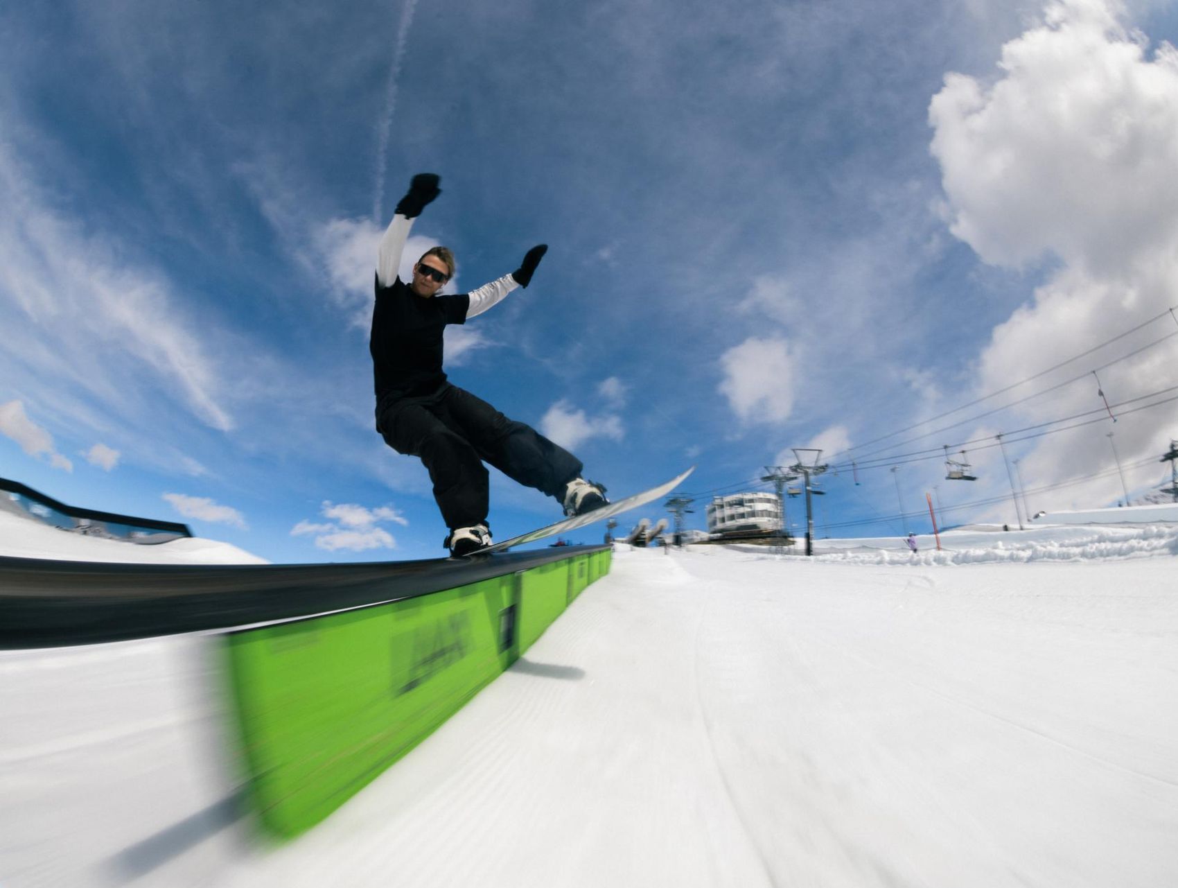 Snowboarder on rail in NoName Park