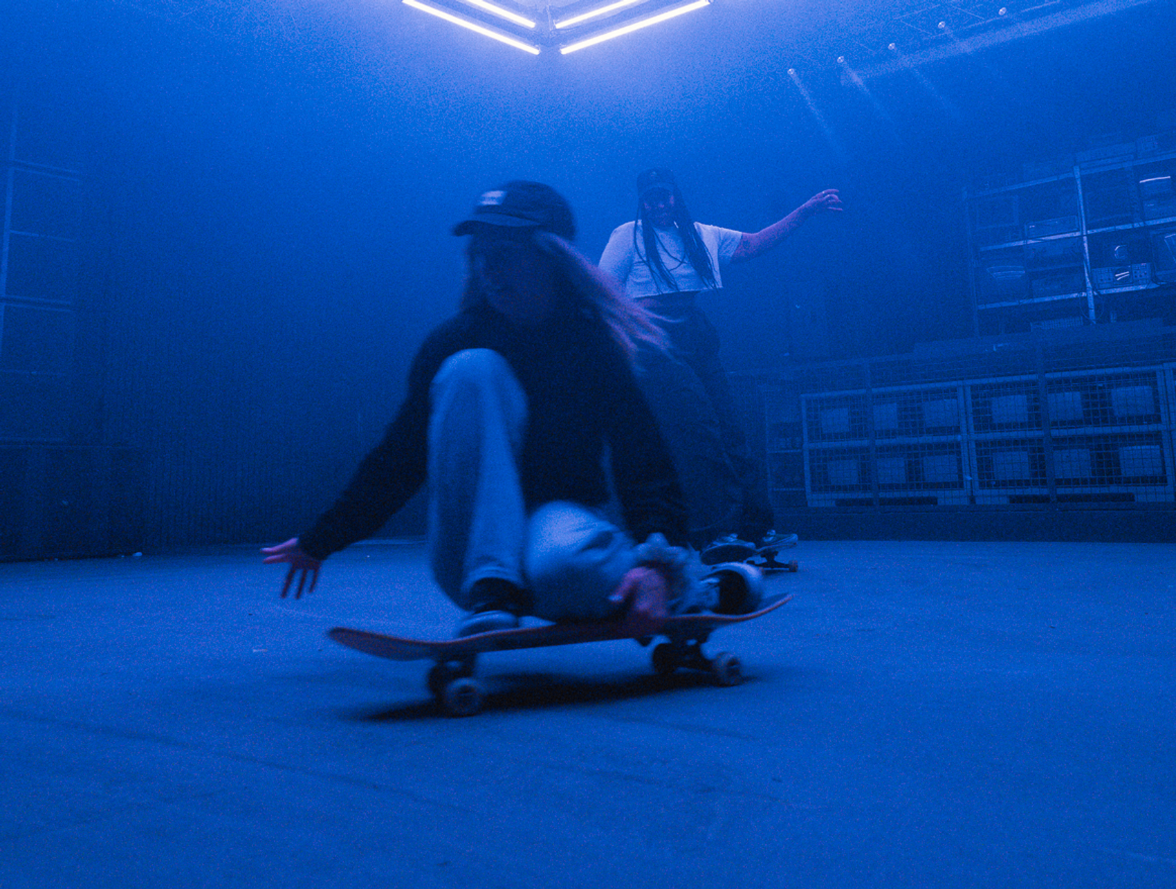 Two women skating in the riders club