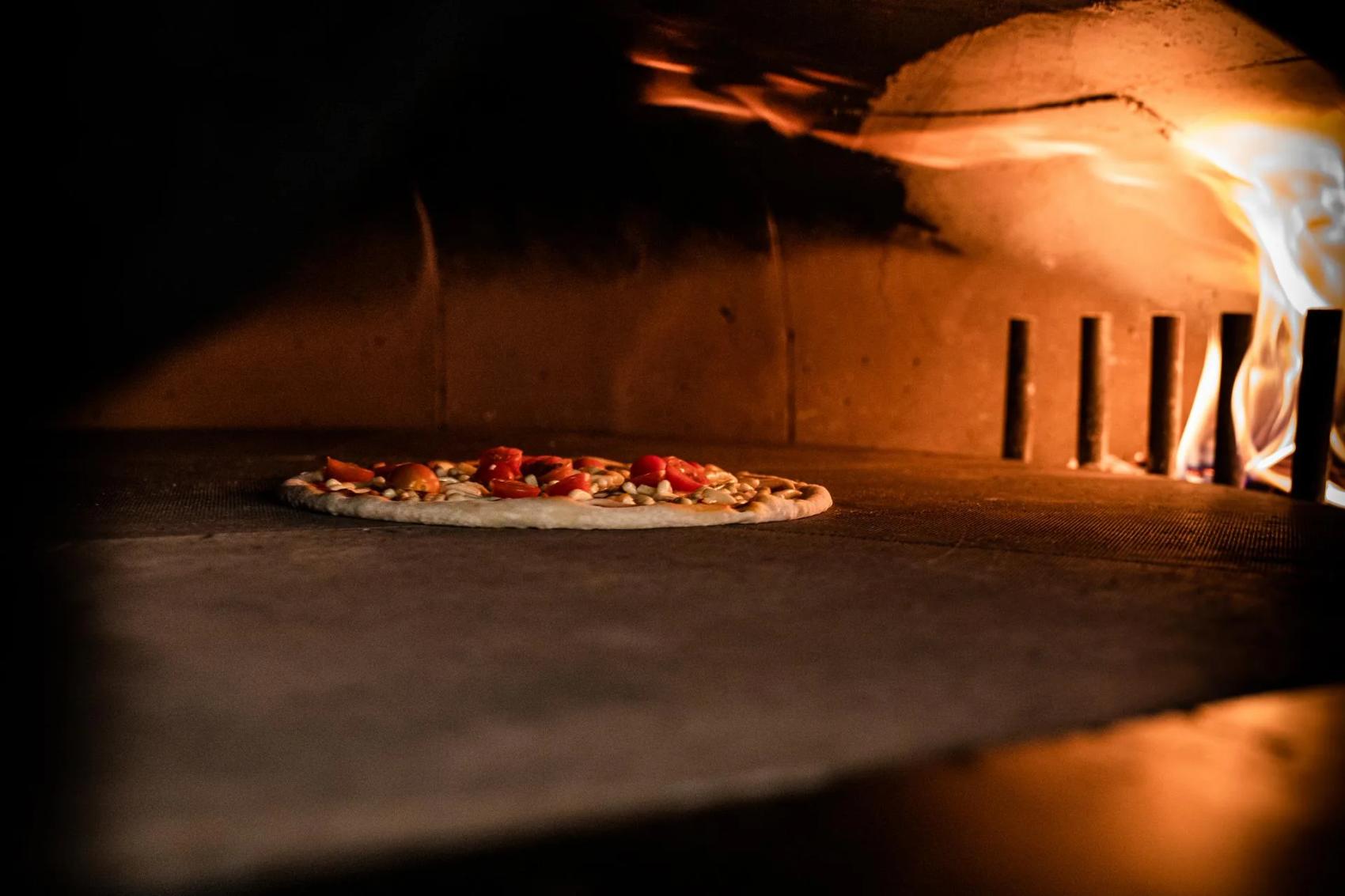 Pizza in the wood oven