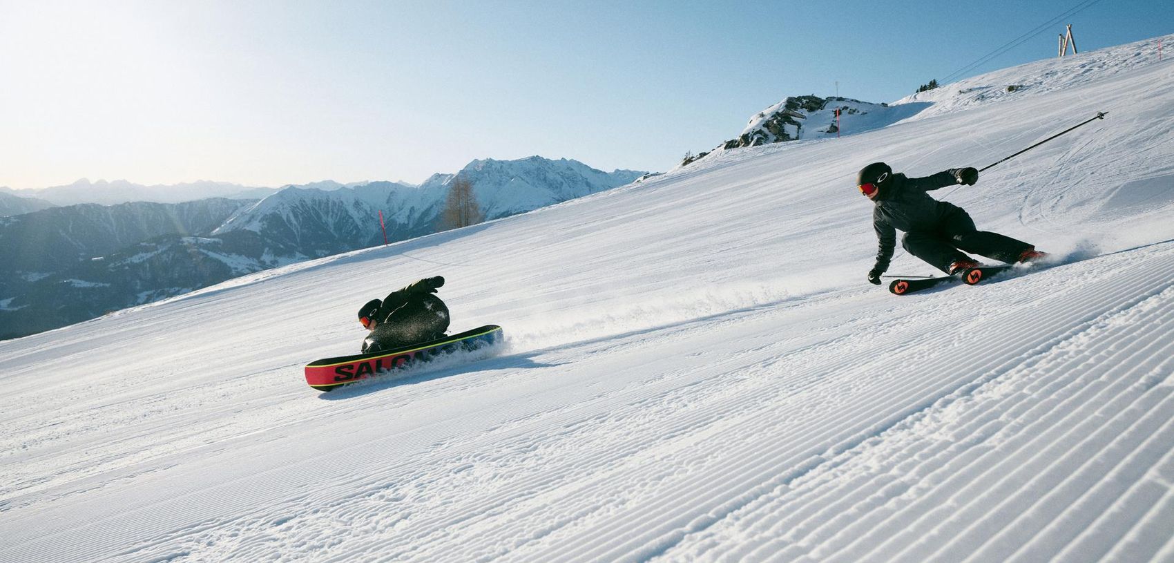 Snowboarder and skiers on the slope
