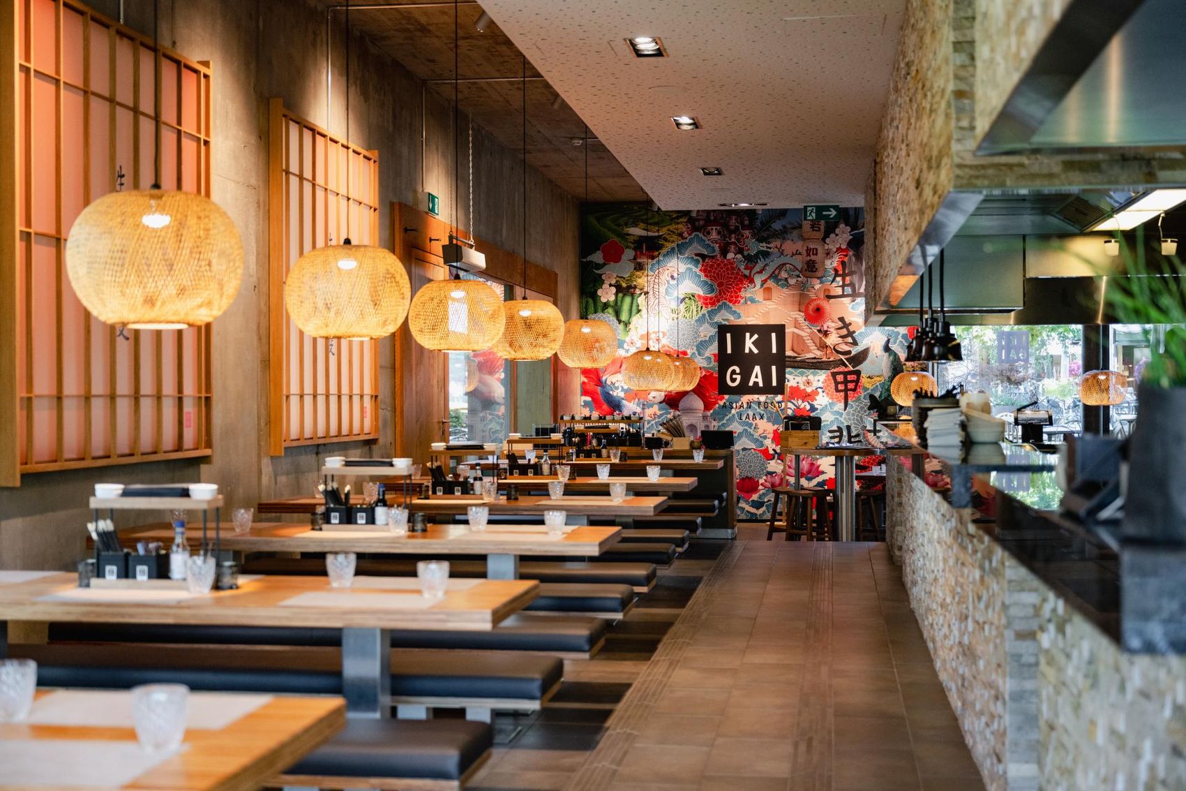 Chefs of the IKIGAI Restaurant at the stove.