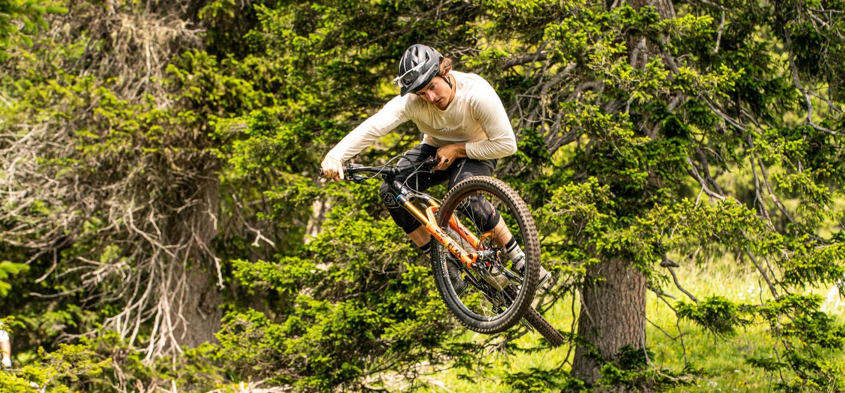 Biker jumps with bike into the air