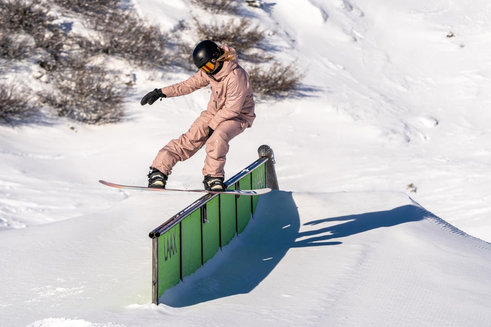 Snowboarder on rail