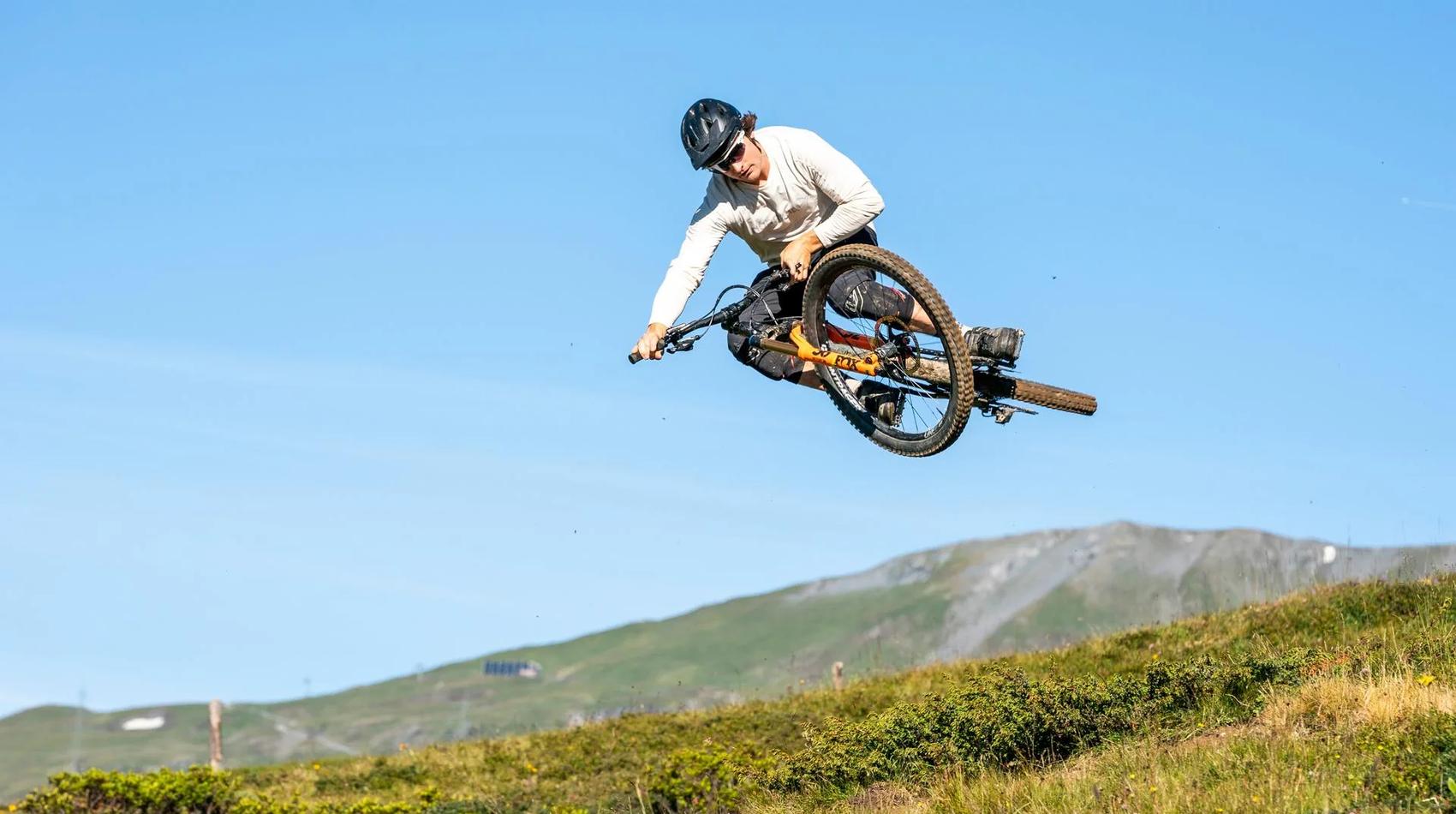 Biker jumps with bike into the air