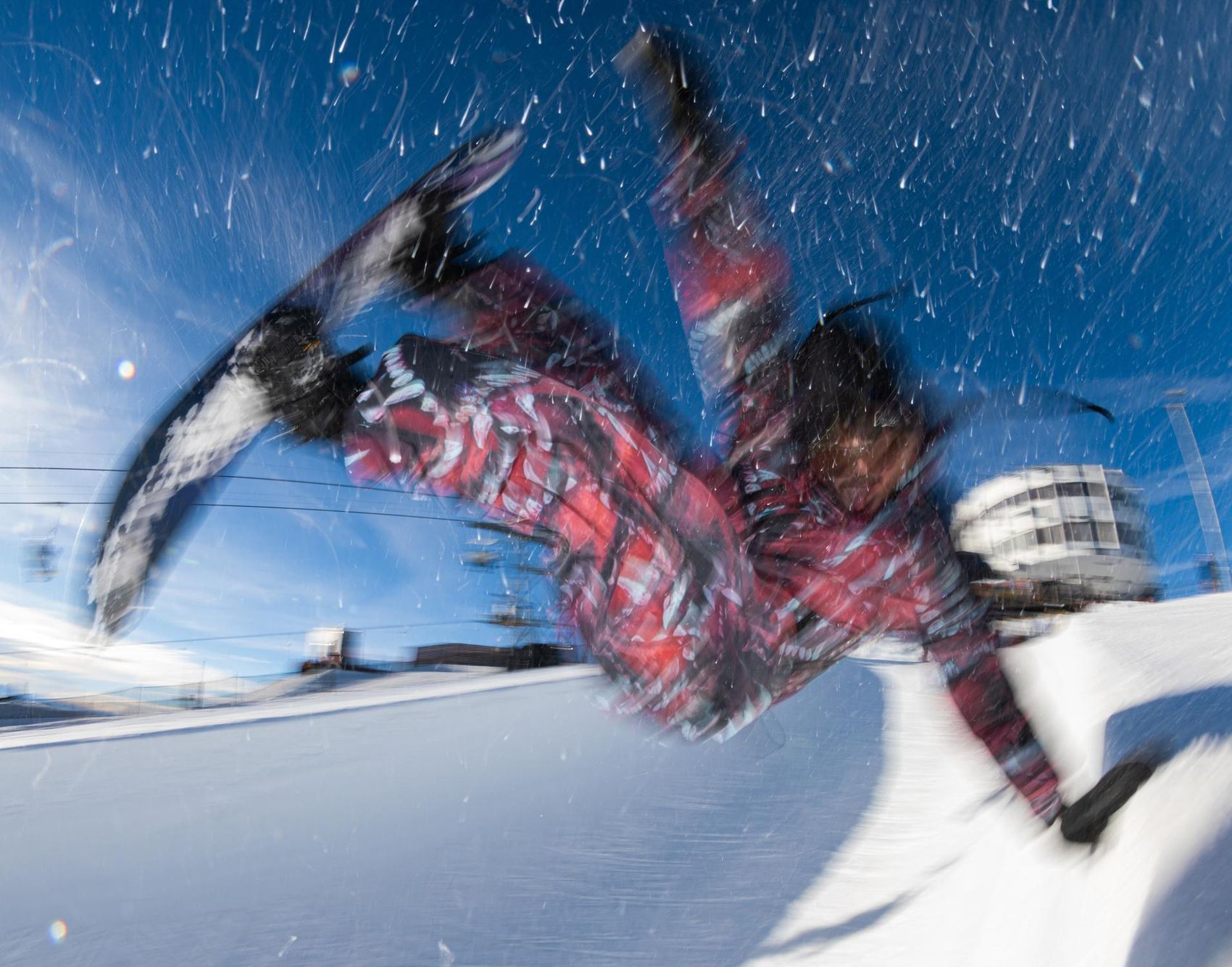 Biker jumps over a kicker.