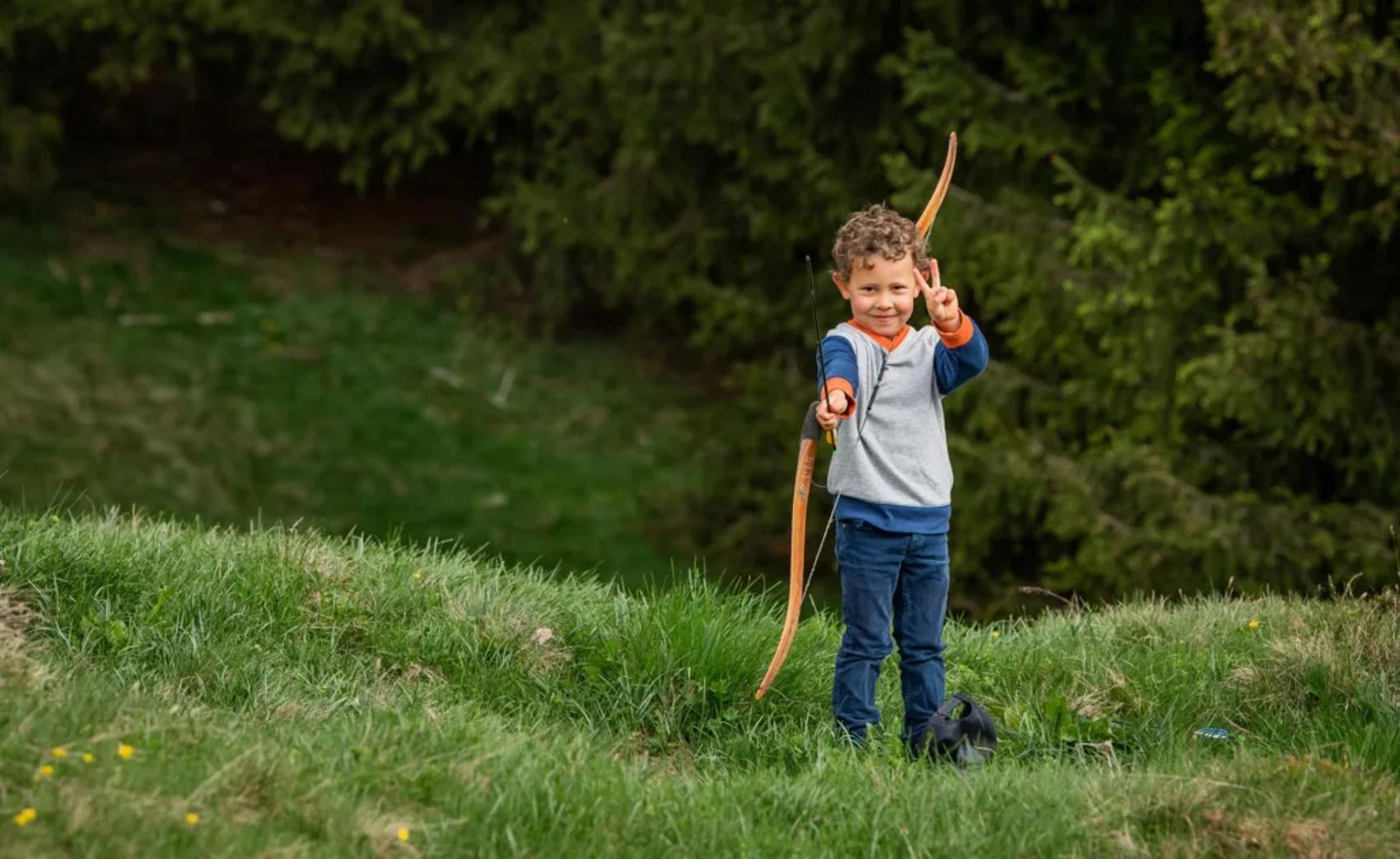 Child with a bow and arrows