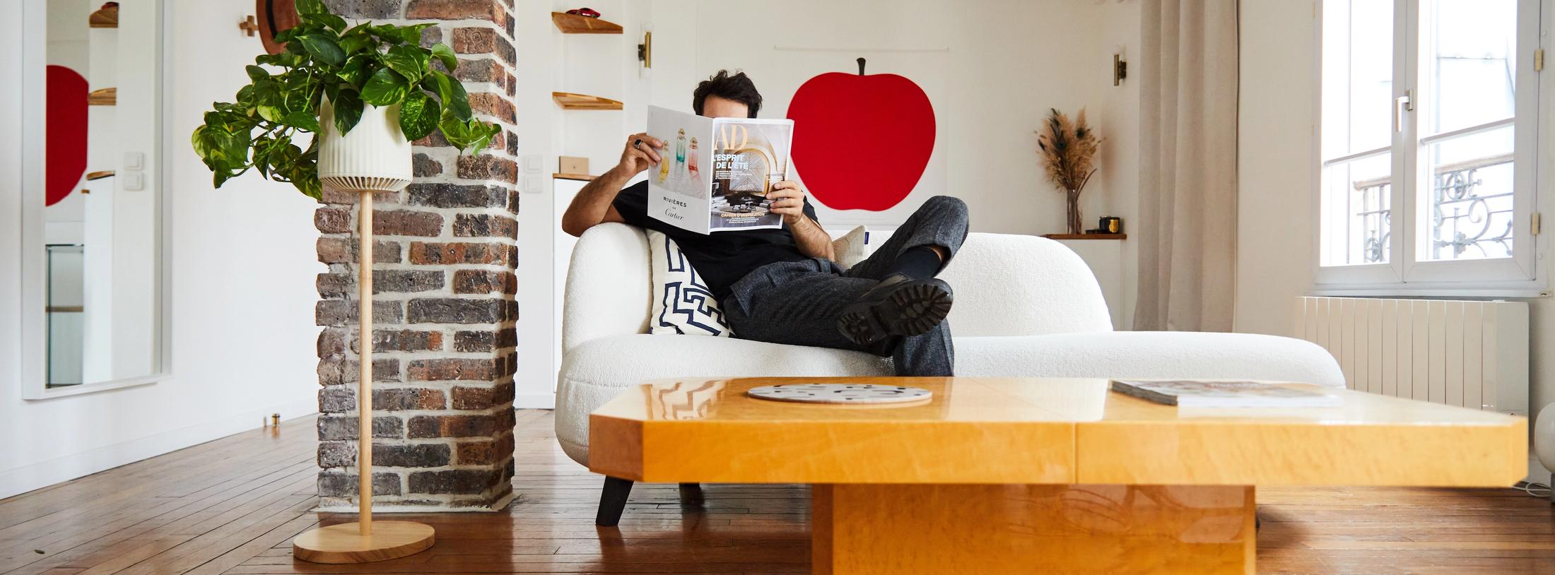 man sitting in his living room beside a neo px