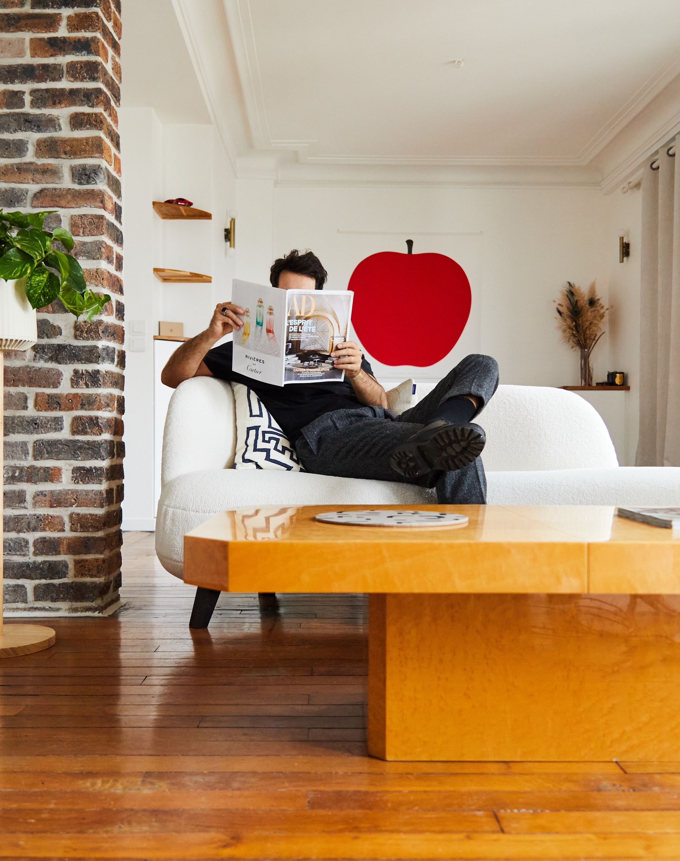 man sitting in his living room beside a neo px