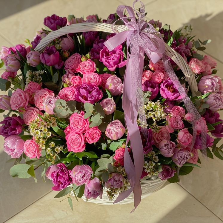 Bright roses in large basket  