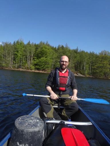 A picture of myself during a vacation in Sweden sitting in a canoe.