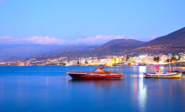 Boats floating off shore in Hersonissos, Crete