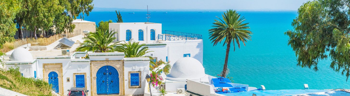 Traditional Tunisian house against turquoise sea