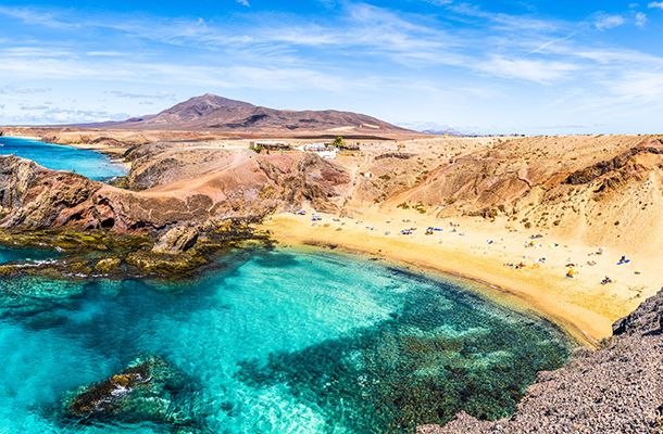 Golden sands & turquoise waters at a beach in Lanzarote
