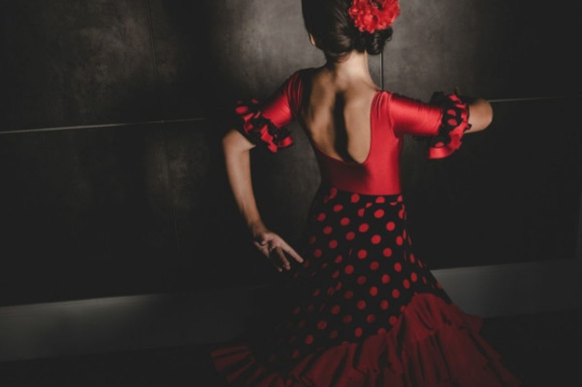 The most traditional dance in Spain, a woman dancing to the Flamenco.