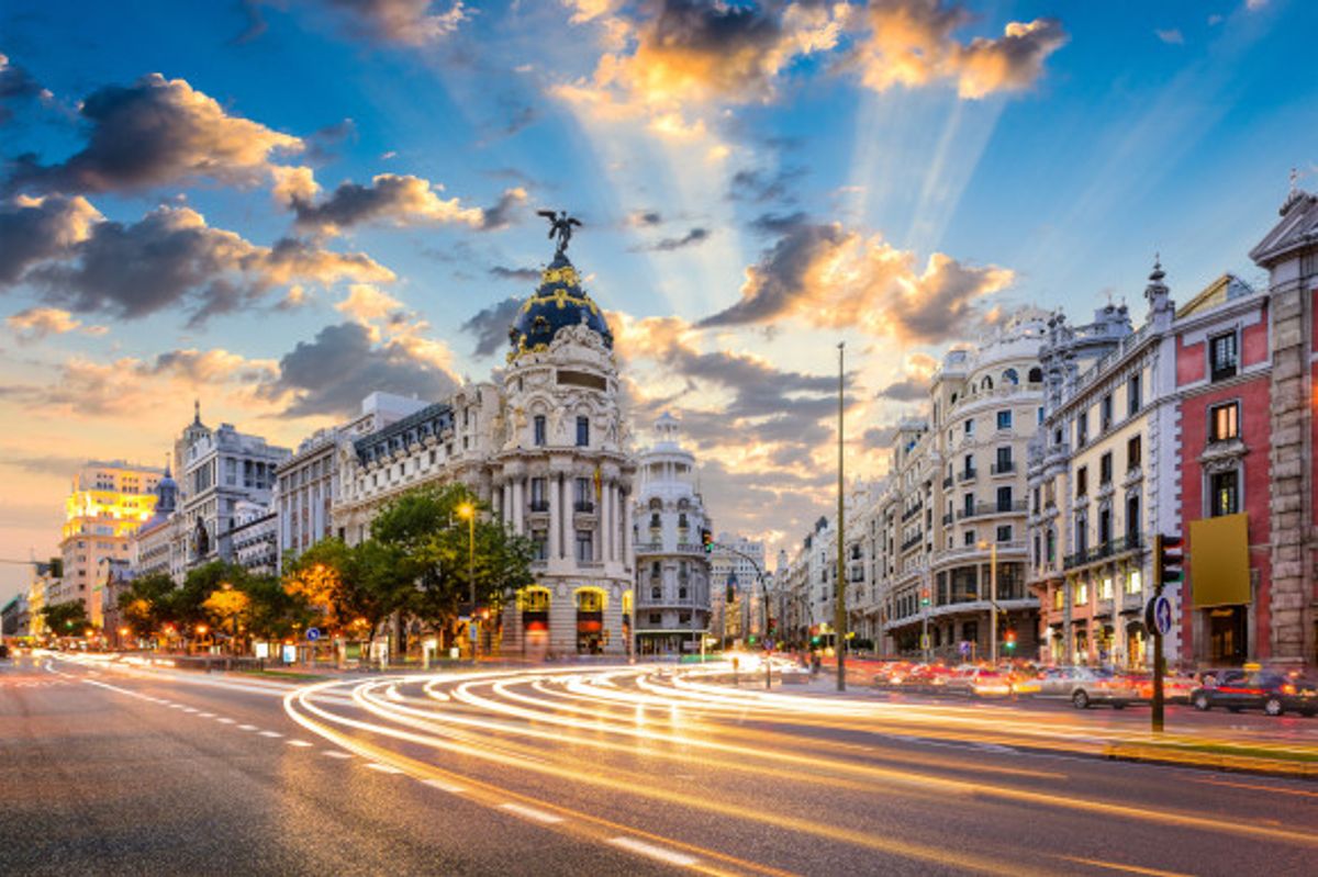 A view of Calle de Alcala and Gran Via in Madrid surrounded by blue skies