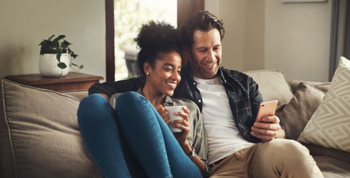 Couple looking at mobile phone