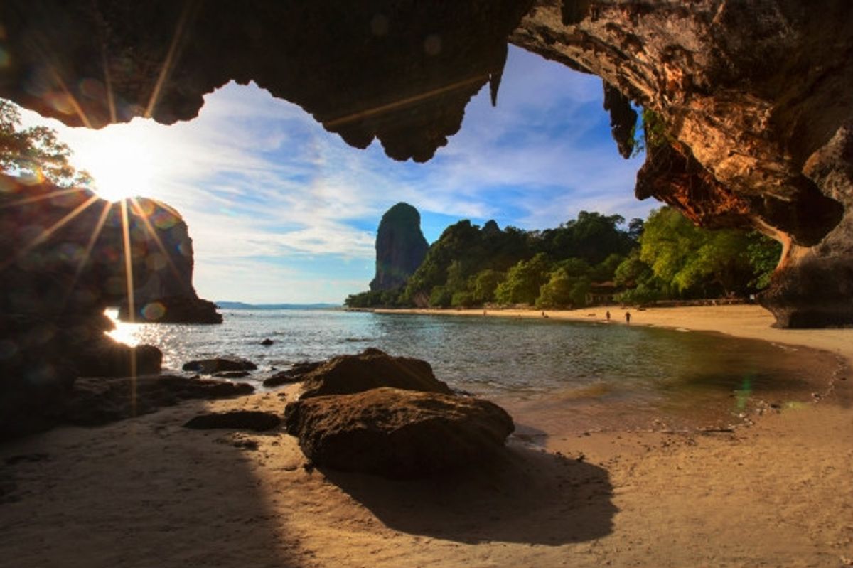 Hidden cave on the beach looking out onto the sand and ocean