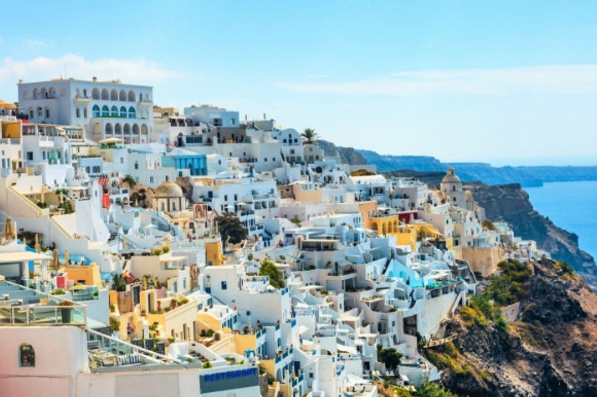Jaw dropping panorama of the whitewashed resort of Fira in Santorini, Greece.