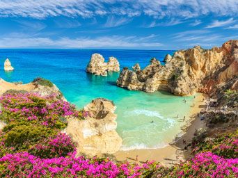 Cliffs & golden sands on a beach in Portugal