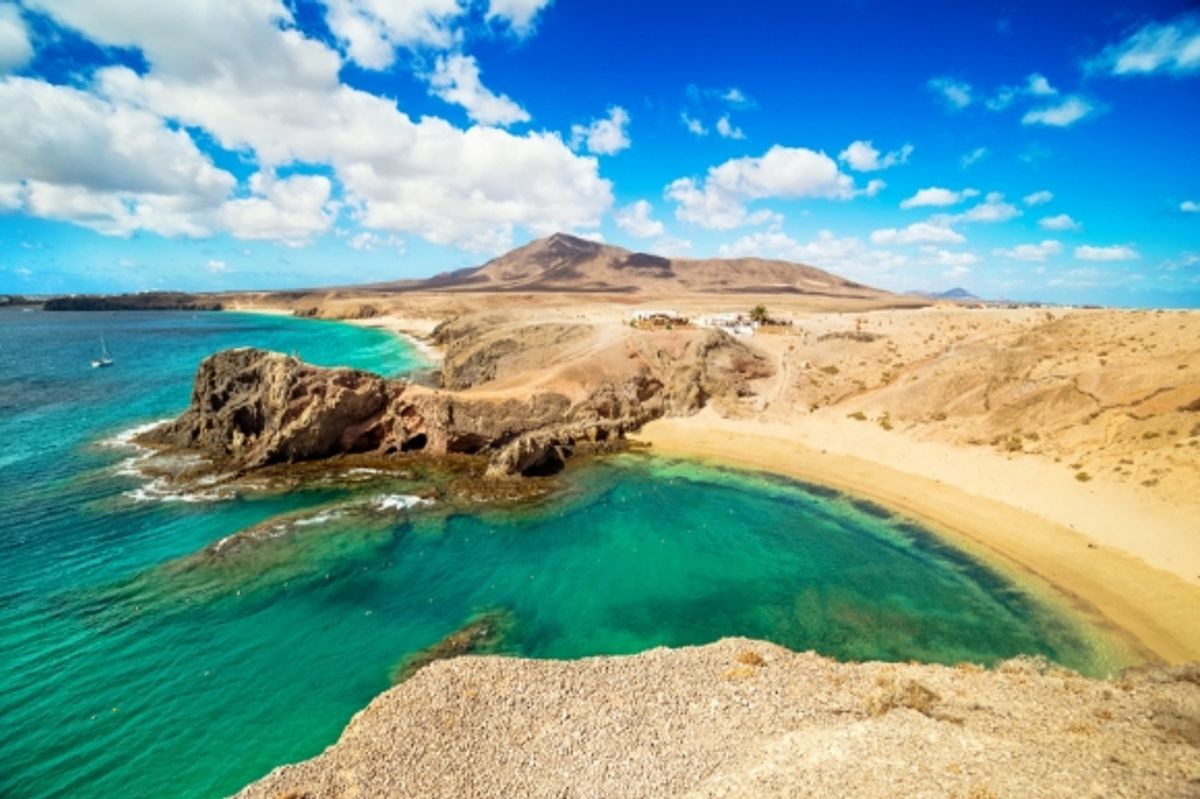 An incredible beach in Lanzarote with azure waters and golden sands