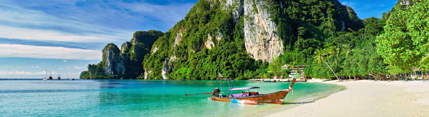 Long tail boat on a beach in Thailand