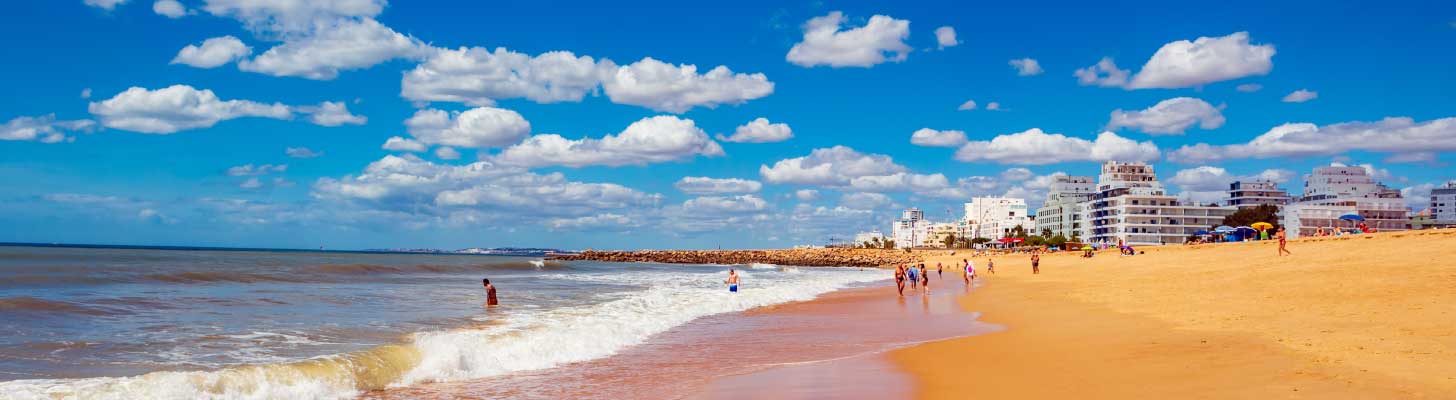 Golden sands of Quarteira beach in the Algarve