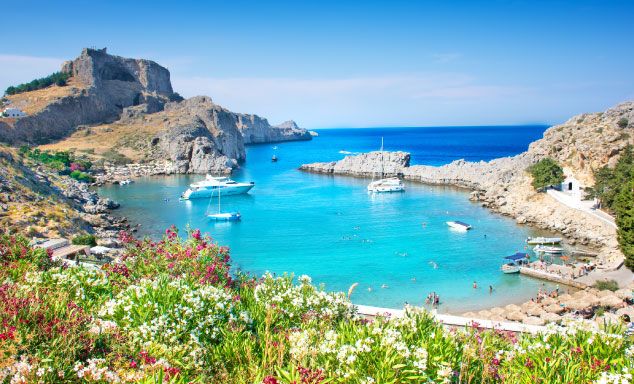 Boats in the water off the shore in Rhodes
