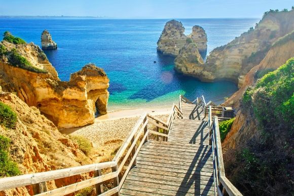 Steps leading down to sandy beach