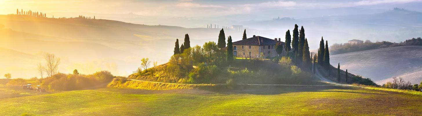 Tuscan house with cyprus trees in the countryside