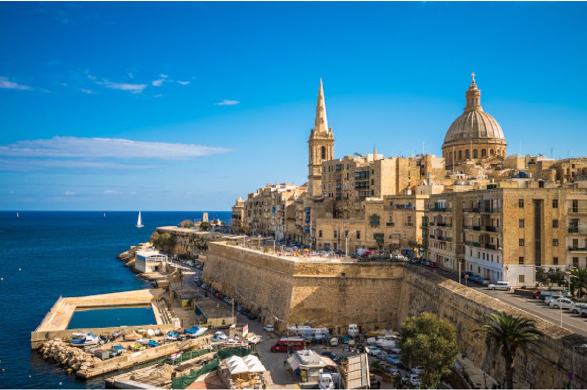 The striking Valletta Waterfront surrounded by shimmering azure waters, Malta